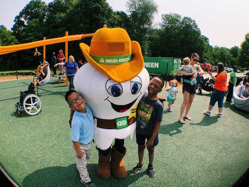 delta dental tooth mascot with kids-mobile.jpg