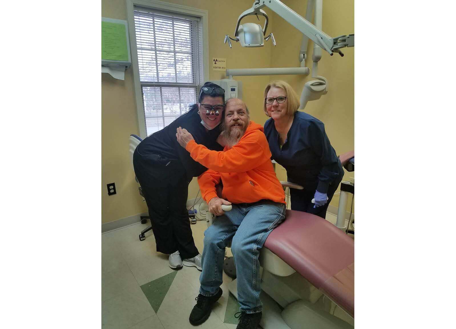 man with dentist and hygienist.jpg
